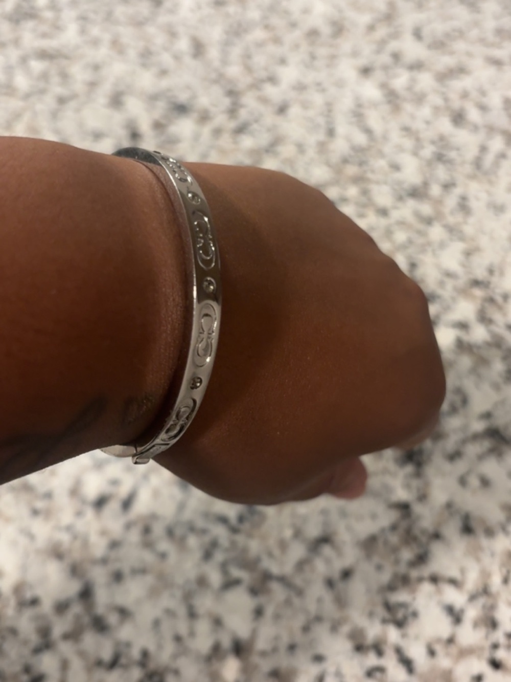 Coach Silver-Tone Engraved Bangle Bracelet